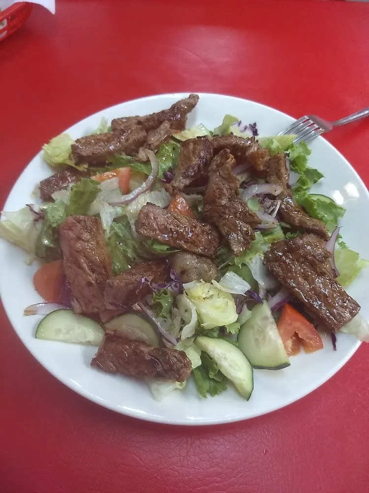Steak over Spring Mix Salad